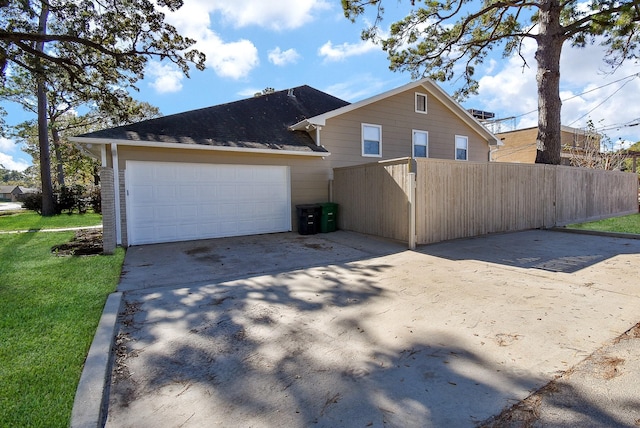 view of side of home featuring a garage