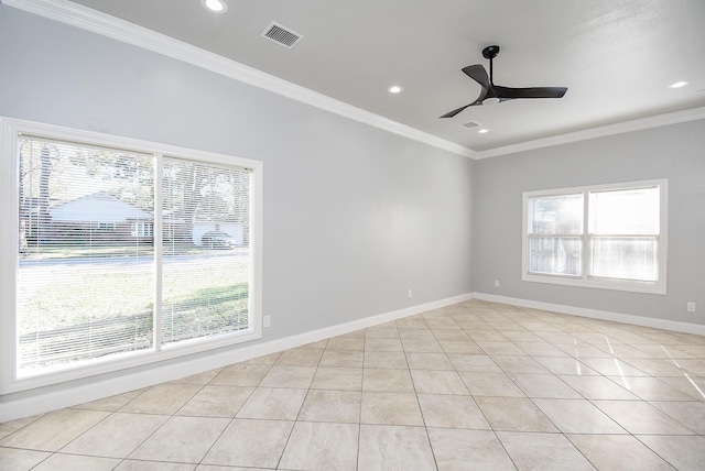 spare room featuring light tile patterned floors, ceiling fan, and ornamental molding