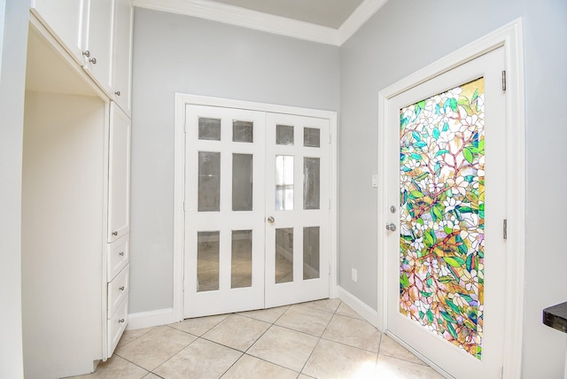 doorway with french doors, crown molding, and light tile patterned flooring