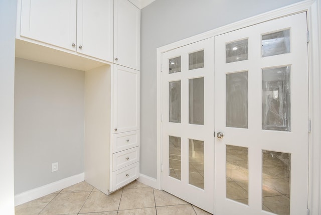 interior space with light tile patterned floors