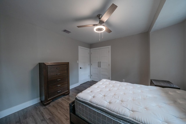 bedroom featuring dark hardwood / wood-style flooring and ceiling fan