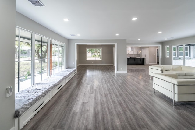 unfurnished living room featuring dark hardwood / wood-style floors