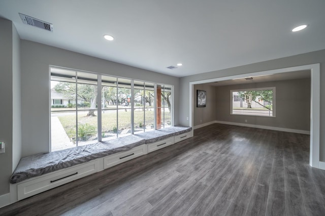 empty room with dark hardwood / wood-style flooring