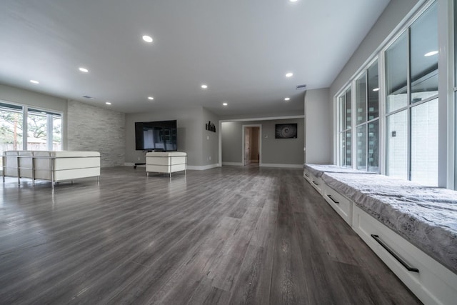 unfurnished living room with dark hardwood / wood-style flooring