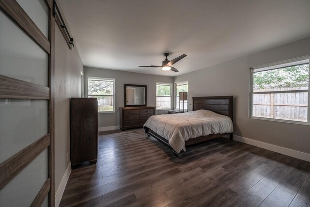 bedroom featuring dark hardwood / wood-style flooring and ceiling fan