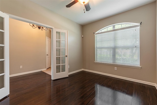 spare room featuring french doors, dark hardwood / wood-style floors, and ceiling fan