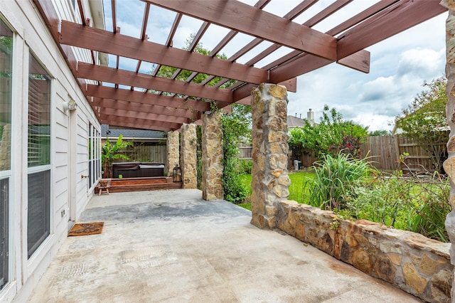 view of patio featuring a pergola and a hot tub