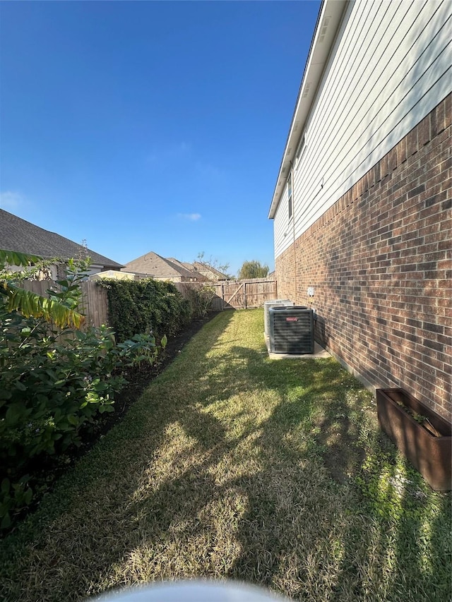 view of yard featuring central AC unit