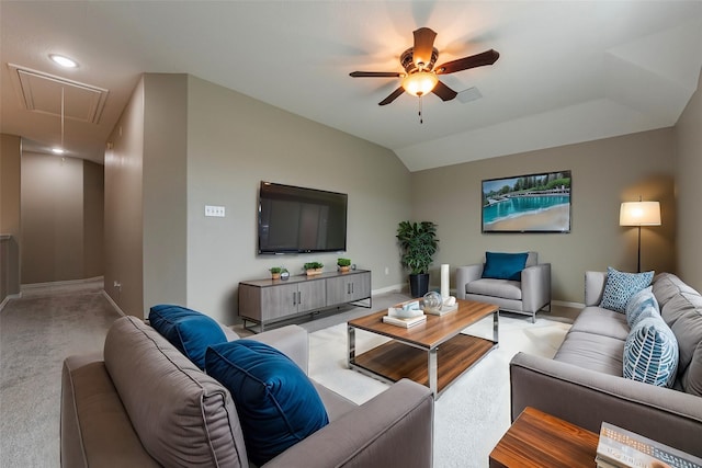 carpeted living room featuring ceiling fan and lofted ceiling