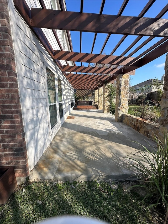 view of patio featuring a pergola