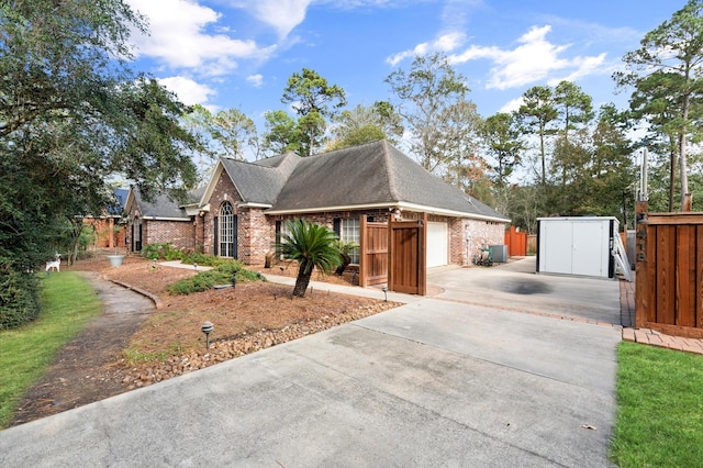 ranch-style house with a storage shed