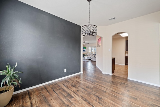 unfurnished dining area featuring dark hardwood / wood-style floors and ceiling fan