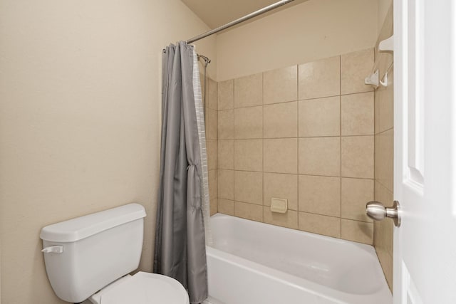 bathroom featuring shower / bathtub combination with curtain and toilet