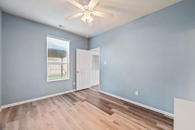 spare room with ceiling fan and light hardwood / wood-style flooring