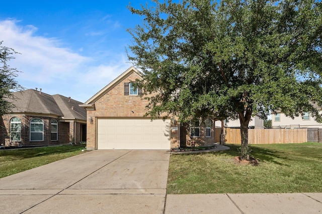 view of front facade with a front yard and a garage