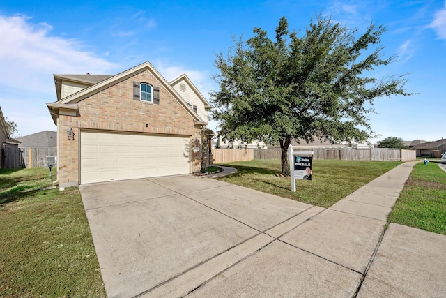 view of front of house featuring a front yard and a garage