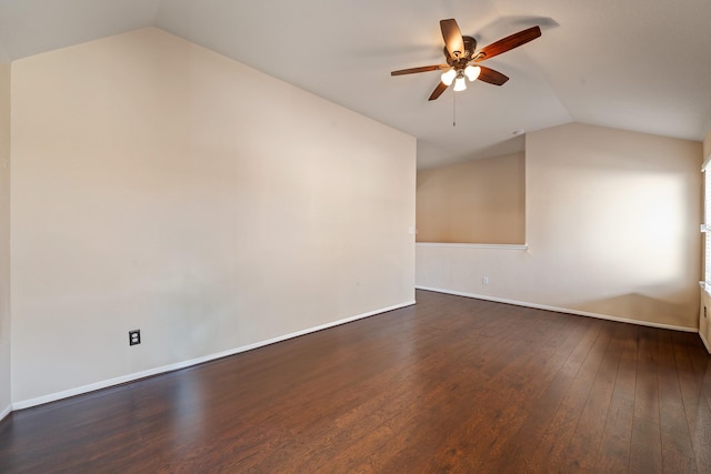 additional living space featuring dark hardwood / wood-style floors, ceiling fan, and vaulted ceiling