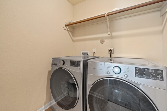 laundry area featuring independent washer and dryer