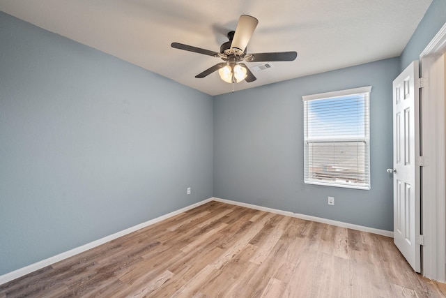 unfurnished room featuring light wood-type flooring and ceiling fan