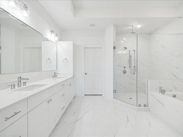 bathroom featuring plus walk in shower and vanity