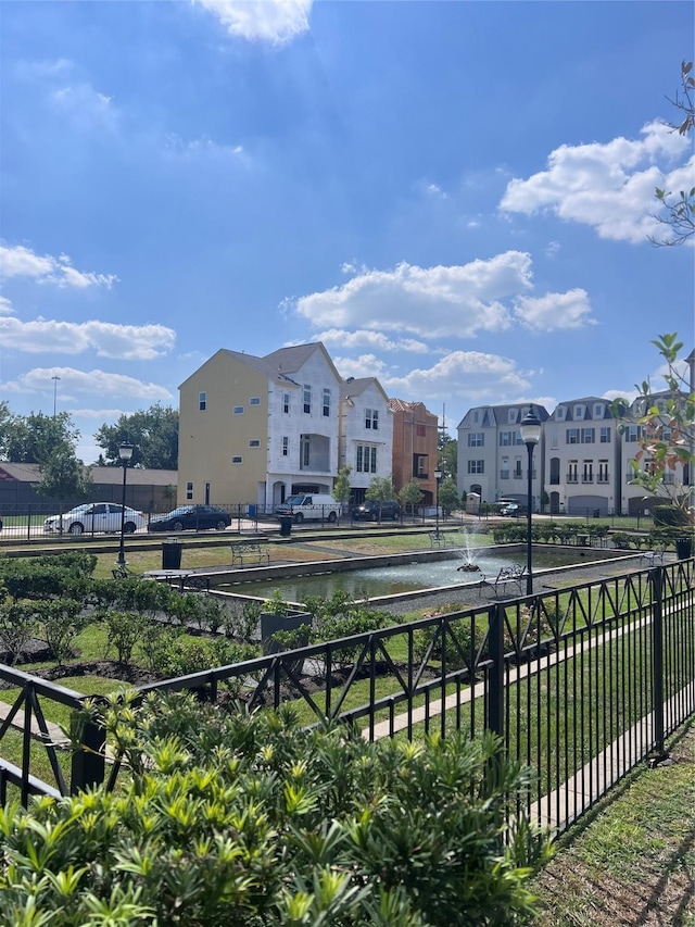 view of home's community with a water view