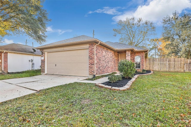 view of front of home with a garage and a front yard