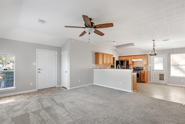 unfurnished living room featuring ceiling fan, lofted ceiling, and light carpet