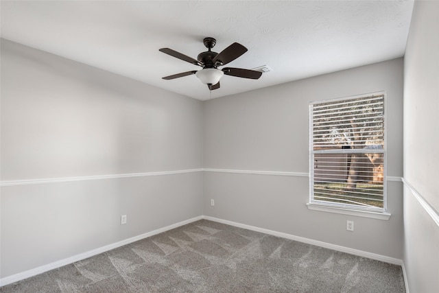 empty room with carpet and ceiling fan