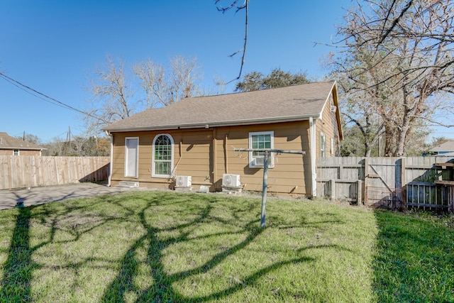 rear view of property with a patio area and a yard