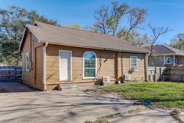 view of front of property featuring ac unit