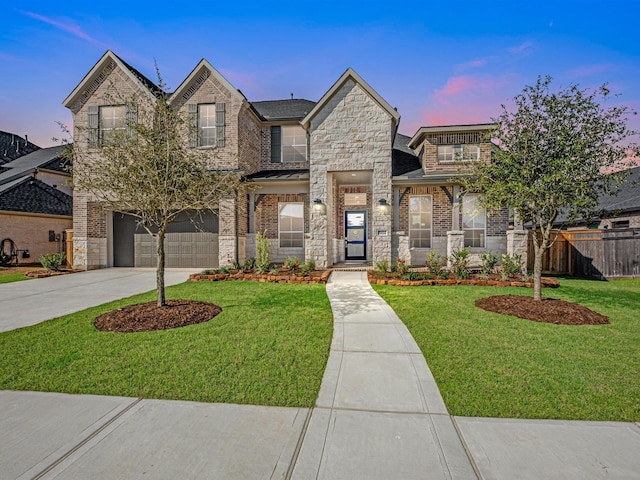 view of front of house with a lawn and a garage