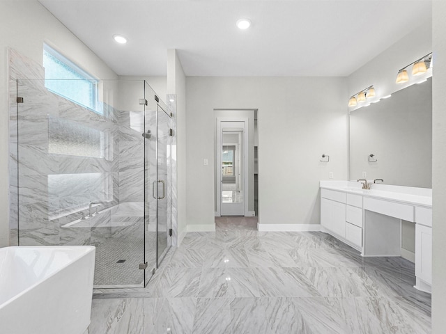 bathroom with separate shower and tub and vanity