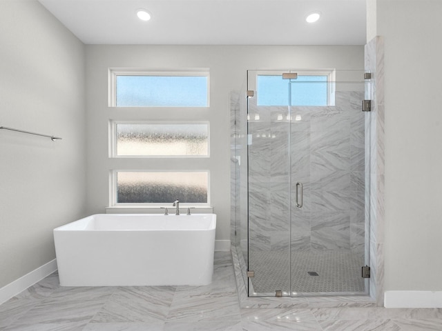 bathroom with plus walk in shower and a wealth of natural light