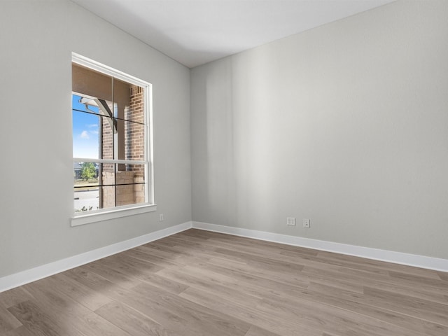 unfurnished room featuring light hardwood / wood-style floors