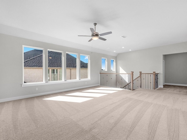 empty room featuring light carpet and ceiling fan