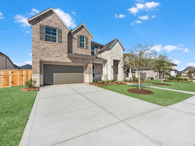 view of front facade featuring a front yard and a garage