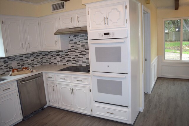 kitchen featuring double oven, white cabinetry, dishwasher, and black electric stovetop