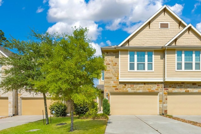 view of front of home featuring a garage and a front lawn