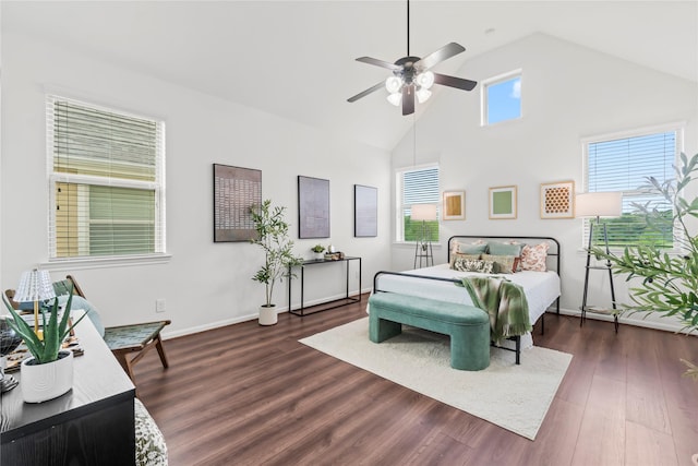 bedroom with ceiling fan, dark hardwood / wood-style flooring, and high vaulted ceiling