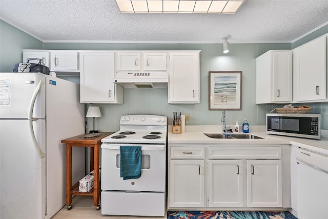 16904 Beachcomber Dr, Galveston, TX 77554 - kitchen featuring white appliances, under cabinet range hood, a textured ceiling, white cabinets, and light countertops