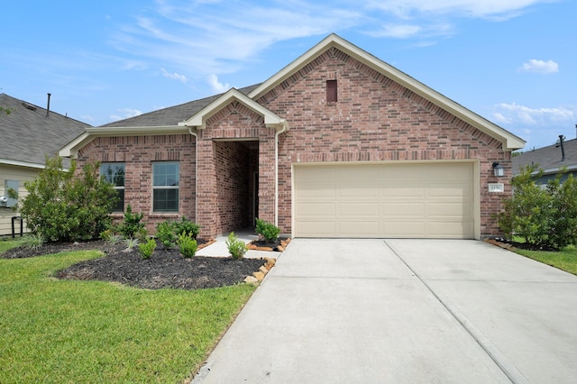 view of front facade featuring a front yard and a garage