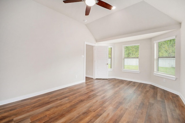 unfurnished room featuring dark hardwood / wood-style flooring, ceiling fan, and lofted ceiling