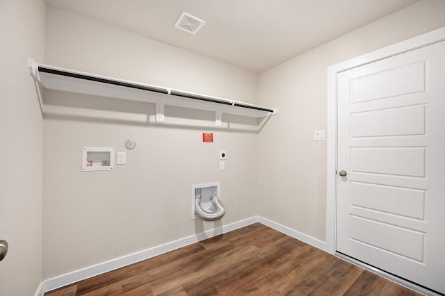 clothes washing area with electric dryer hookup, gas dryer hookup, washer hookup, and dark hardwood / wood-style floors