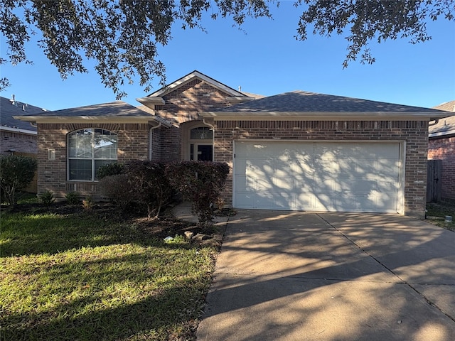 single story home with a front lawn and a garage