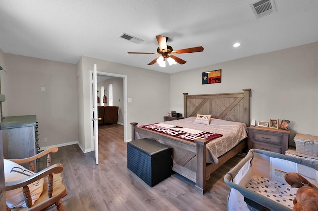 bedroom featuring ceiling fan and hardwood / wood-style floors