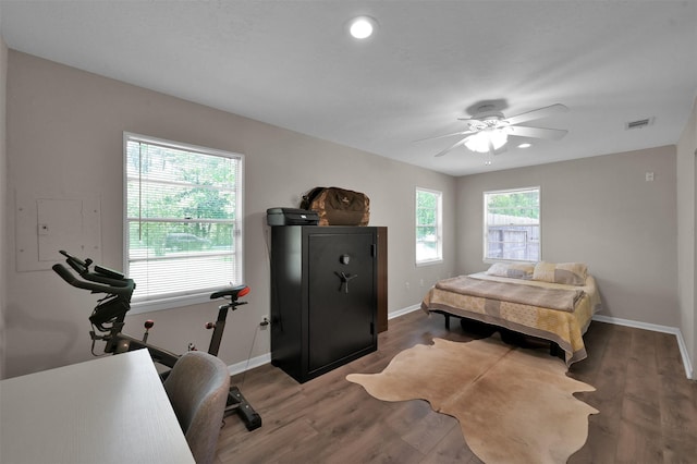 bedroom featuring dark hardwood / wood-style flooring and ceiling fan