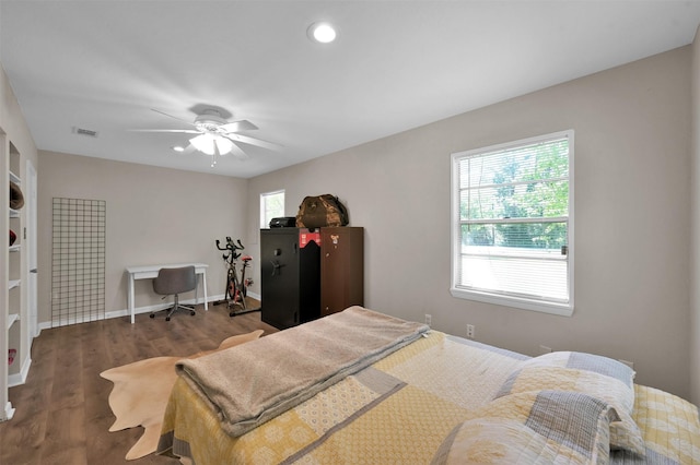 bedroom featuring ceiling fan and dark hardwood / wood-style flooring