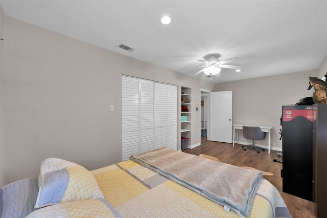 bedroom featuring a closet, ceiling fan, and dark wood-type flooring