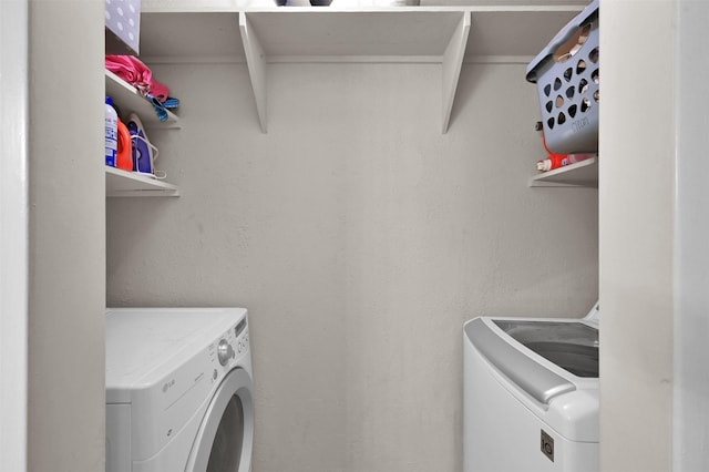 washroom with separate washer and dryer