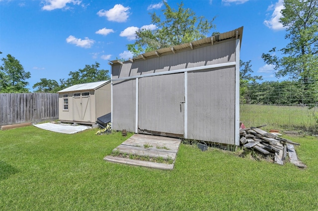 view of outdoor structure featuring a lawn